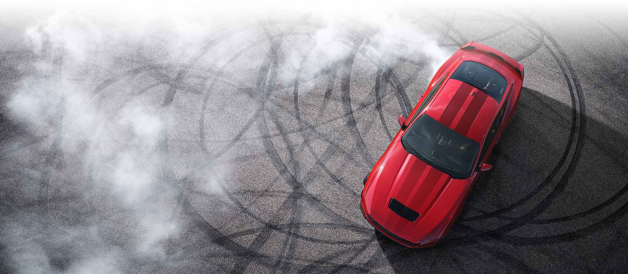 Overhead view of a 2024 Ford Mustang® model with tire tracks on pavement | Swant Graber Ford in Barron WI
